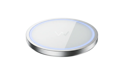 Wireless charging pad with blue light on a white background